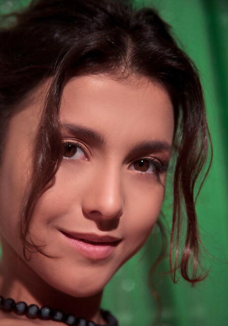 Stunning brunette teen Divina A showing small tits and shaved pussy 