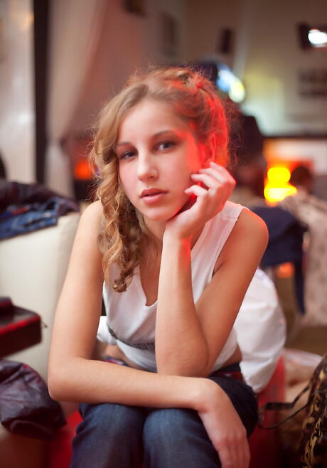 Sexy blond youthful Erika F exposes small tits and spreads her legs outside